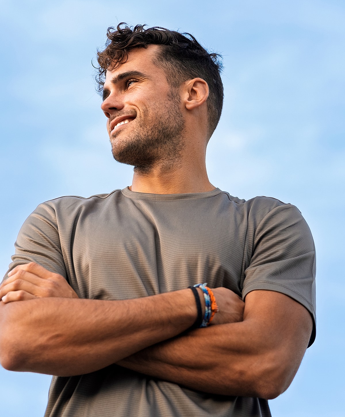 Smiling Torrance Long COVID Treatment man with crossed arms and athletic shirt.