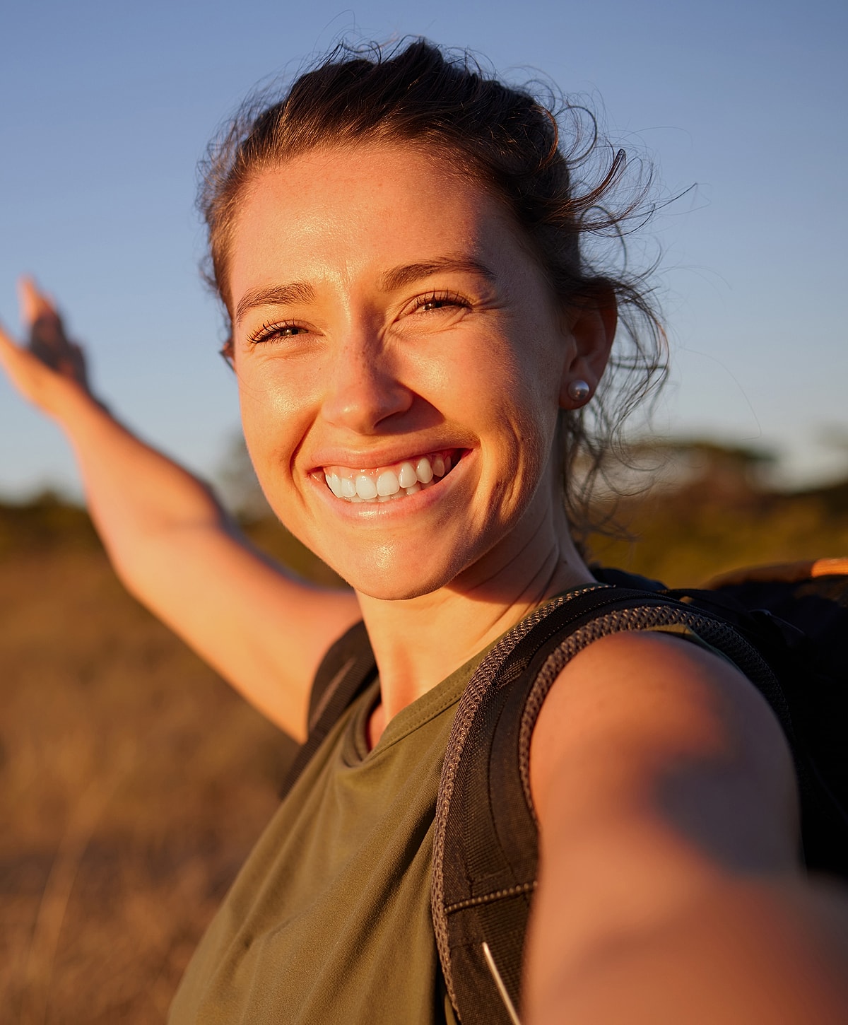 Smiling Torrance psychotherapy woman enjoying outdoor adventure at sunset.