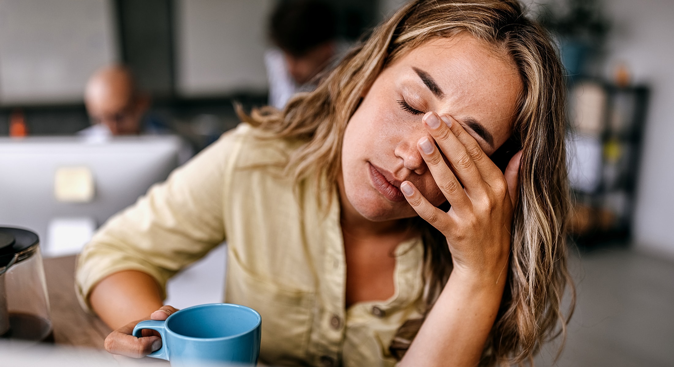 Torrance Chronic Fatigue Syndrome Treatment woman looking stressed while holding a coffee cup.